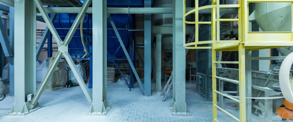 Modern operational plant equipment with some bags of chemicals heavy industry machinery metalworking workshop concept